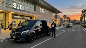 Luxury private SUV parked outside Los Cabos SJD Airport for transfer